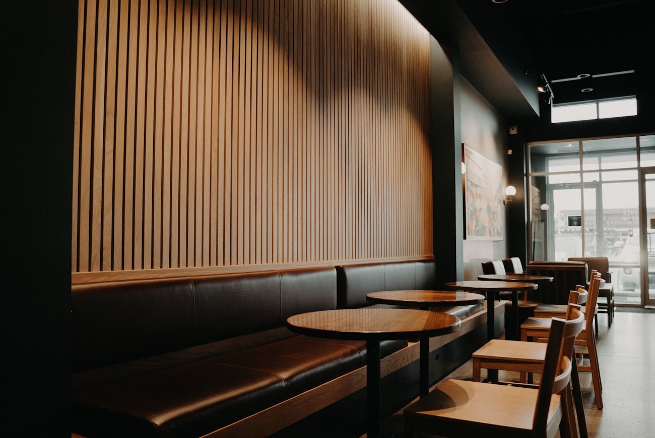 The café's wooden booth seating bathed in warm afternoon light