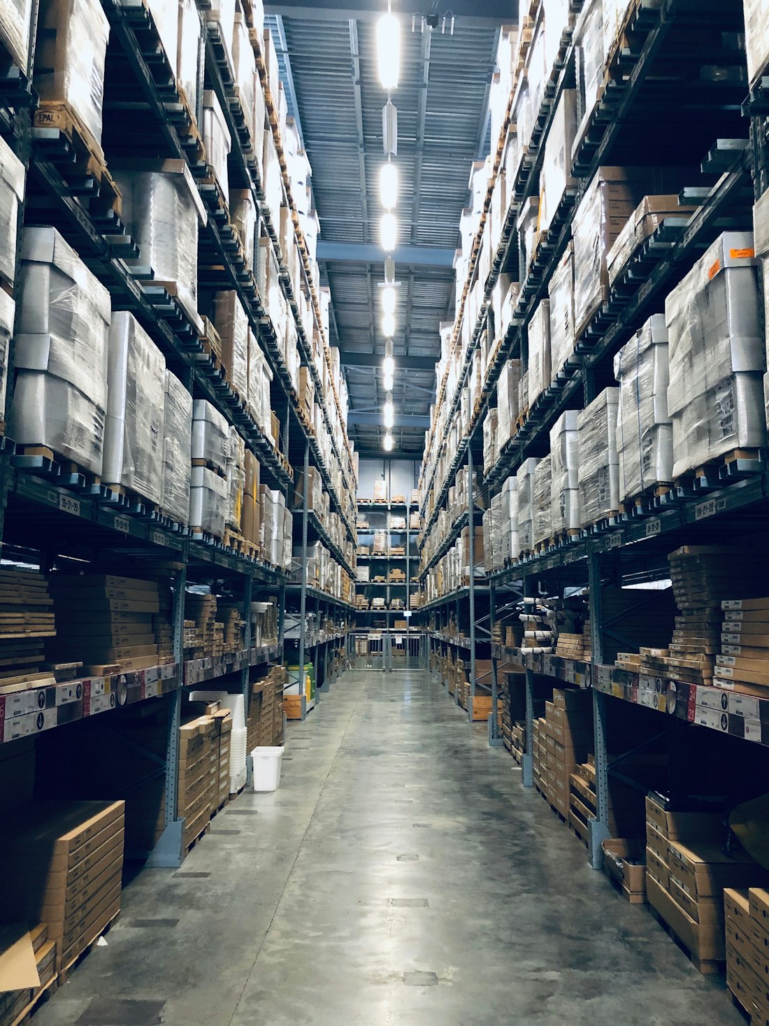 Tall stockroom shelves packed with crates of records at the back of the store