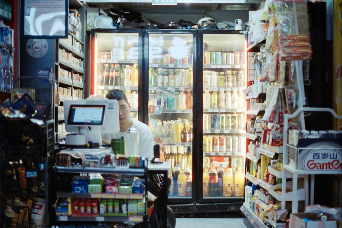 A person standing behind the counter at a record store